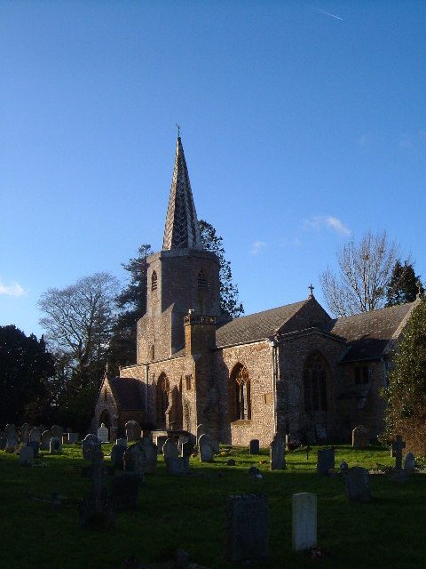 The church tower and spire in low winter sunlight