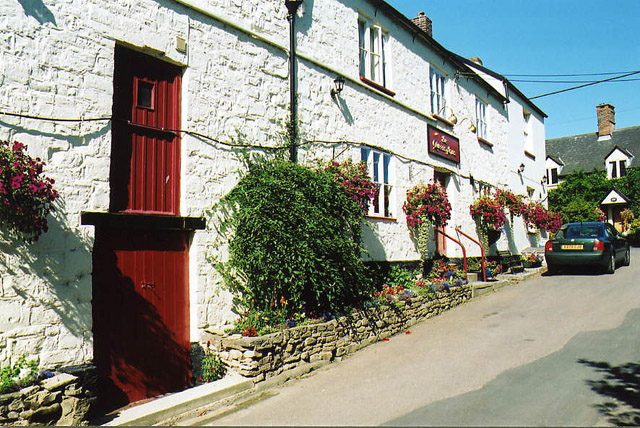 The Queen's Arms, a stone and rendered building beside the road at Pitminster